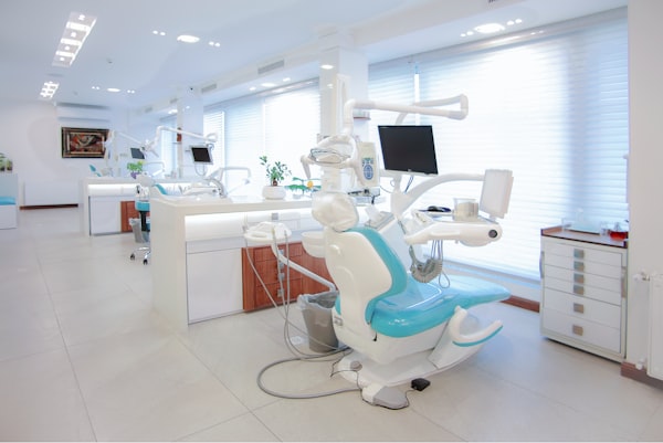 Clear dental aligner held in soft light